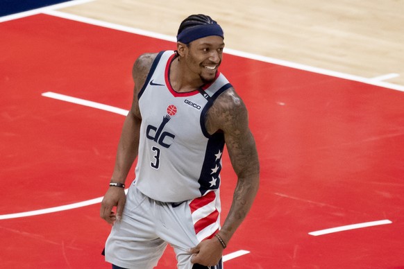 epa09240140 Washington Wizards guard Bradley Beal reacts after making a three-point shot during the second half of the NBA basketball playoff game between the Washington Wizards and the Philadelphia 7 ...