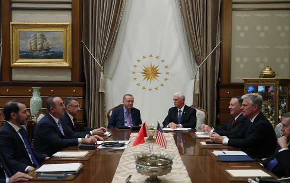 epa07927882 A handout picture provided by Turkish Presidential press office shows Turkish President Recep Tayyip Erdogan (C-L) and US Vice President Mike Pence (C-R) meet in Ankara, Turkey 17 October  ...