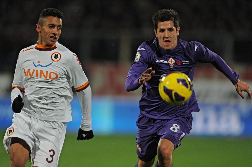 epa03539688 Fiorentina&#039;s forward Stevan Jovetic (R) contrasted by As Roma&#039;s defender Marquinhos (L) during the Italy Cup quarter final soccer match Fiorentina vs Roma at Artemio Franchi stad ...