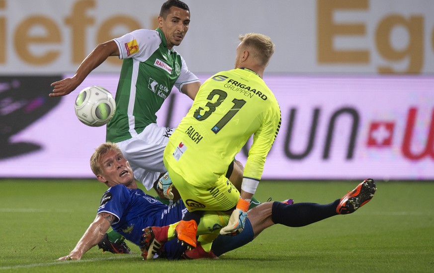 St.Gallen&#039;s Yannis Tafer, middle, fights for the ball against Sarpsborg&#039;s Joonas Tamm and goalkeeper Aslak Falch during the first leg of the Europa League second round qualification match be ...