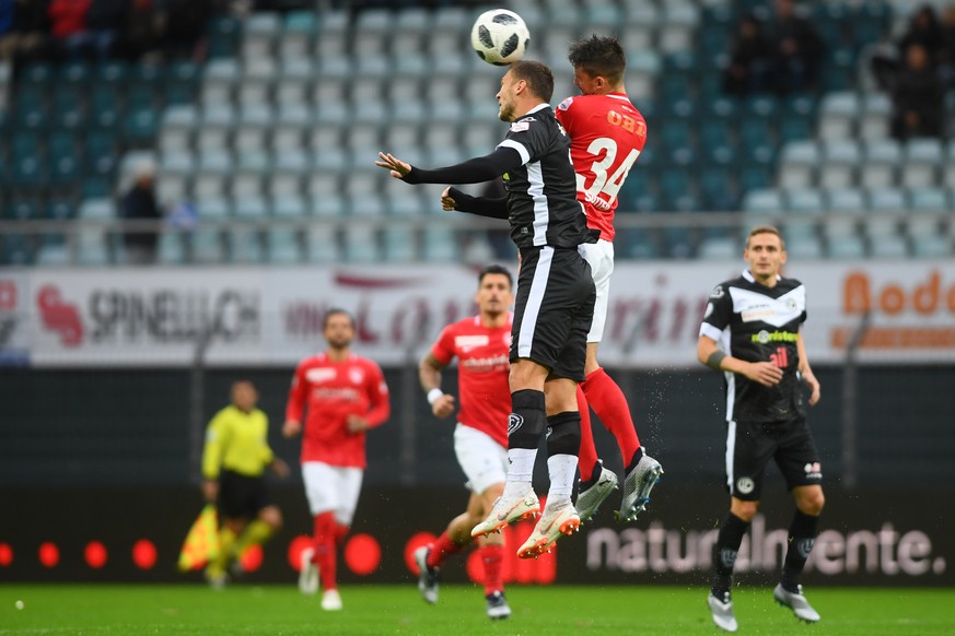 Lugano&#039;s player Balint Vecsei, fight for the ball with Thun&#039;s player Nicola Sutter, right, during the Super League soccer match between FC Lugano and FC Thun, at the Cornaredo stadium in Lug ...
