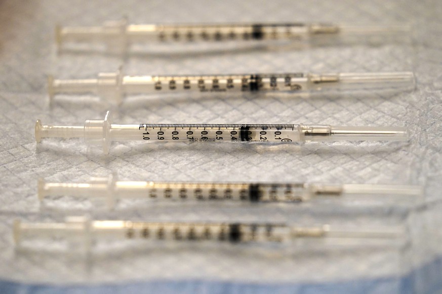 FILE - In this Dec. 17, 2020 file photo, prepared COVID-19 Pfizer-BioNTech vaccine syringes are seen at Edward Hospital in Naperville, Ill. The U.S. government is negotiating with Pfizer to acquire te ...