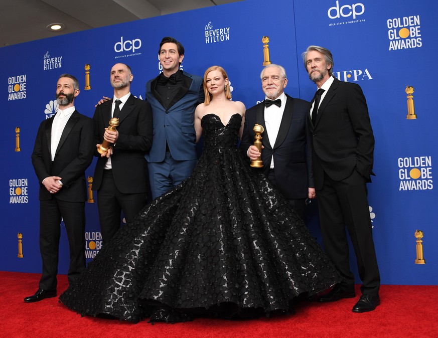 epa08107049 (L-R) Jeremy Strong, Jesse Armstrong with the awarad for Best Television Series - Drama for &#039;Succession&#039;, Nicholas Braun, Sarah Snook, Brian Cox, holding the award for Best Perfo ...