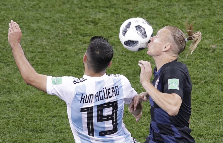 Argentina&#039;s Sergio Aguero, left, and Croatia&#039;s Domagoj Vida, right, compete for the ball during the group D match between Argentina and Croatia at the 2018 soccer World Cup in the Nizhny Nov ...