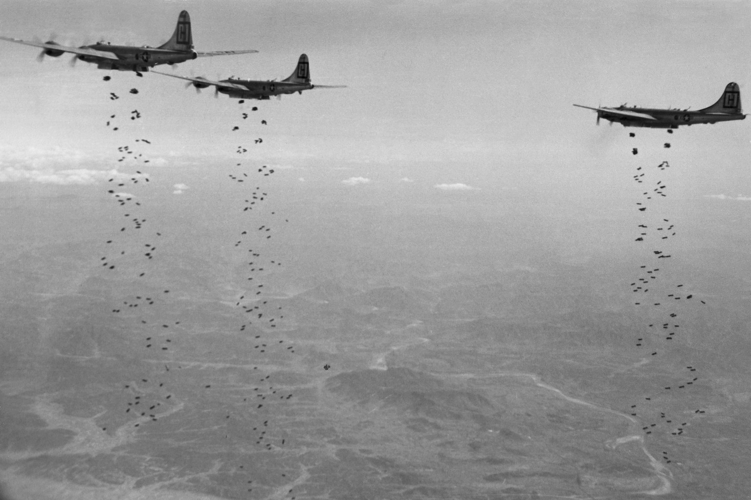 In this Jan. 18, 1951, file photo, Bomber Command planes of the U.S. Far East Air Forces rain tons of high demolition bombs in North Korea. North Koreans claim 400,000 bombs were dropped on Pyongyang  ...