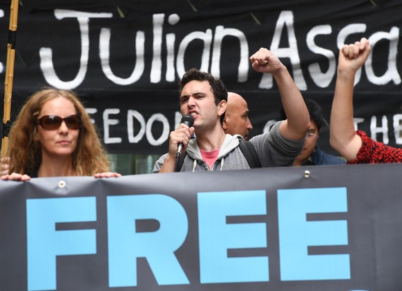 epa07500603 People hold a banner during a rally calling for the release WikiLeaks founder Julian Assange, in Sydney, Australia, 12 April 2019. The President of Ecuador, Lenin Moreno, withdrew asylum o ...