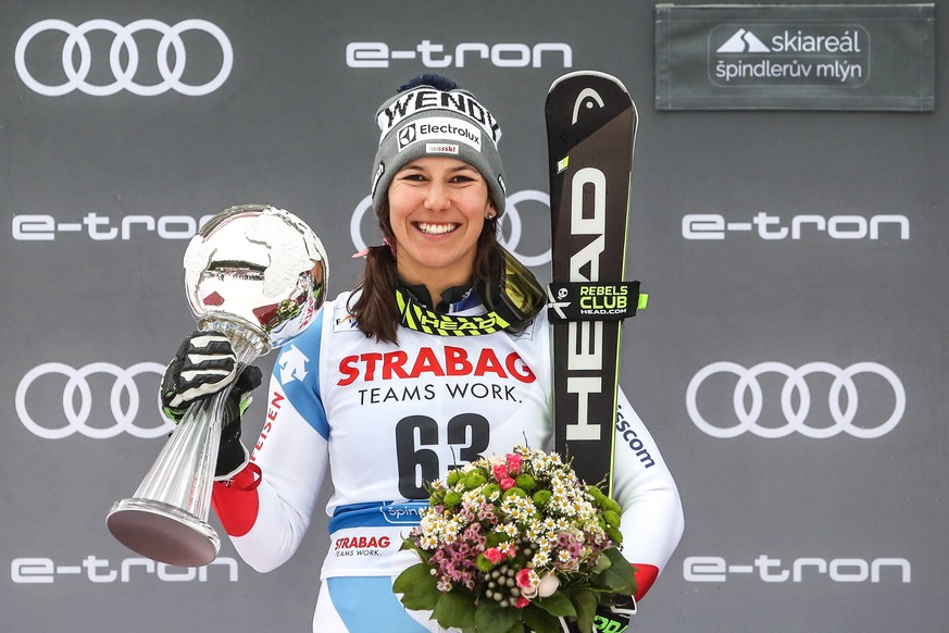 epa07424573 Second placed Wendy Holdener of Switzerland celebrates on the podium during trophy ceremony of Women&#039;s Slalom race at the FIS Alpine Skiing World Cup in Spindleruv Mlyn, Czech Republi ...
