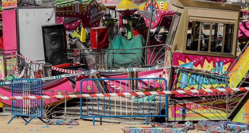 epa07634603 A view of damage to an amusement ride after an accident occurred in the early hours at a fairground in San Jose de la Rinconada, Seville, Spain, 08 June 2019. The accident resulted in 28 p ...
