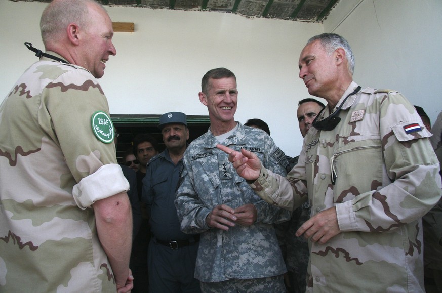 FILE- In this Thursday June 25, 2009, file photo the head of Dutch troops in Uruzgan province, Brig. Gen. T. A. Middendorp, right, listens to Gen. Stanley McChrystal, the head of U.S. and NATO forces  ...