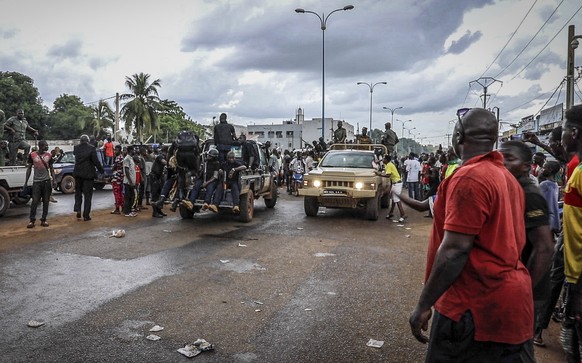 epa08611759 Malians cheer as Mali military enter the streets of Bamako, Mali, 18 August 2020. Mali military have seized Mali President Ibrahim Boubakar Keita in what appears to be a coup attempt. EPA/ ...