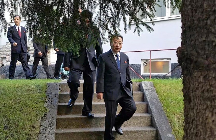 epa07897894 A handout photo made available by the Joint Press Corps shows North Korean delegates, including top negotiator Kim Myong-gil, leaving the North Korean embassy in Stockholm, Sweden, 05 Octo ...