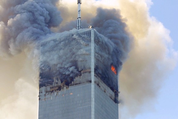 FILE- In this Tuesday, Sept. 11, 2001 file photo, fire and smoke billows from the north tower of New York&#039;s World Trade Center after terrorists crashed two hijacked airliners into the World Trade ...