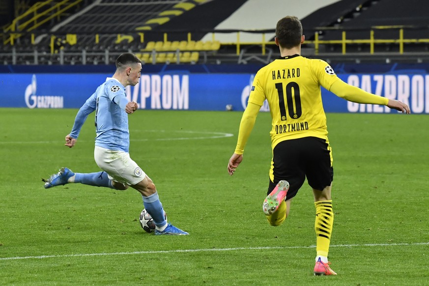 Manchester City&#039;s Phil Foden scores his side&#039;s second goal during the Champions League quarterfinal second leg soccer match between Borussia Dortmund and Manchester City at the Signal Iduna  ...