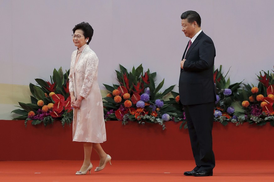 FILE - In this Saturday, July 1, 2017, file photo, Chinese President Xi Jinping, right, looks at Hong Kong&#039;s new Chief Executive Carrie Lam after administering the oath for a five-year term in of ...