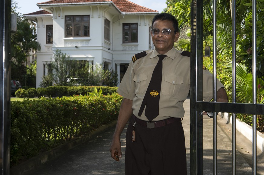 A security guard poses for the photographer in front of the Swiss Embassy in Colombo, Sri Lanka, Monday, September 22, 2014. A media trip is organised by FDFA (Federal Department of Foreign Affairs) t ...