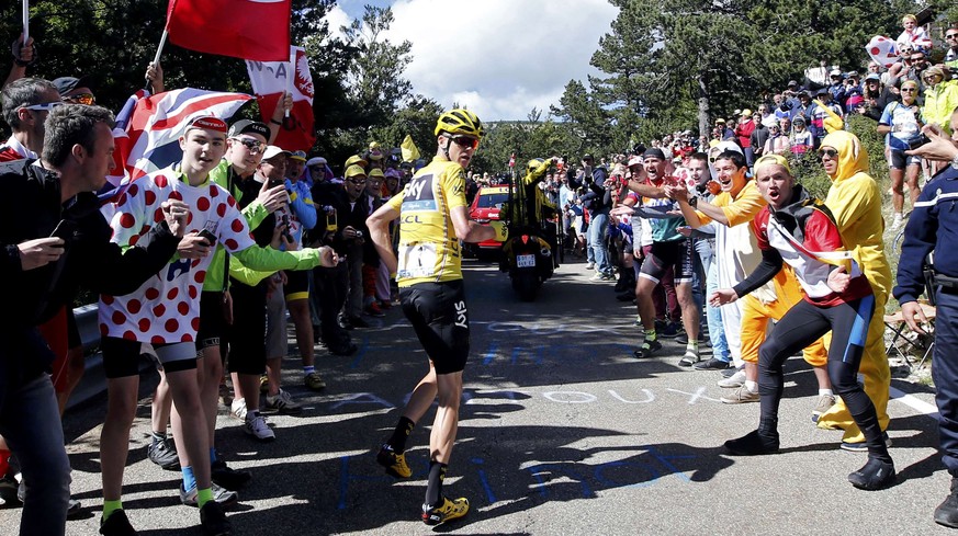 Cycling - The Tour de France cycling race - The 178-km (110.6 miles) Stage 12 from Montpellier to Chalet-Reynard - 14/07/2016 - Yellow jersey leader Team Sky rider Chris Froome of Britain runs on the  ...