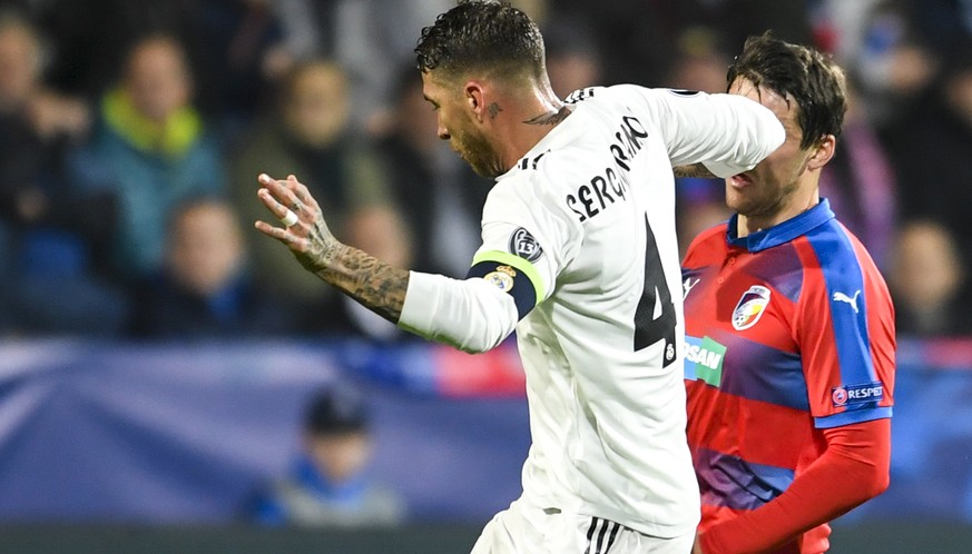 epa07149193 Real Madrid&#039;s Sergio Ramos (L) in action against Plzen&#039;s Milan Havel (R) during the UEFA Champions League group G soccer match between Viktoria Plzen and Real Madrid in Plzen, Cz ...