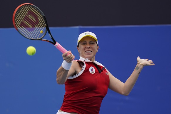 Anastasia Pavlyuchenkova, of the Russian Olympic Committee, plays against Anna-Lena Friedsam, of Germany, during the second round of the tennis competition at the 2020 Summer Olympics, Monday, July 26 ...