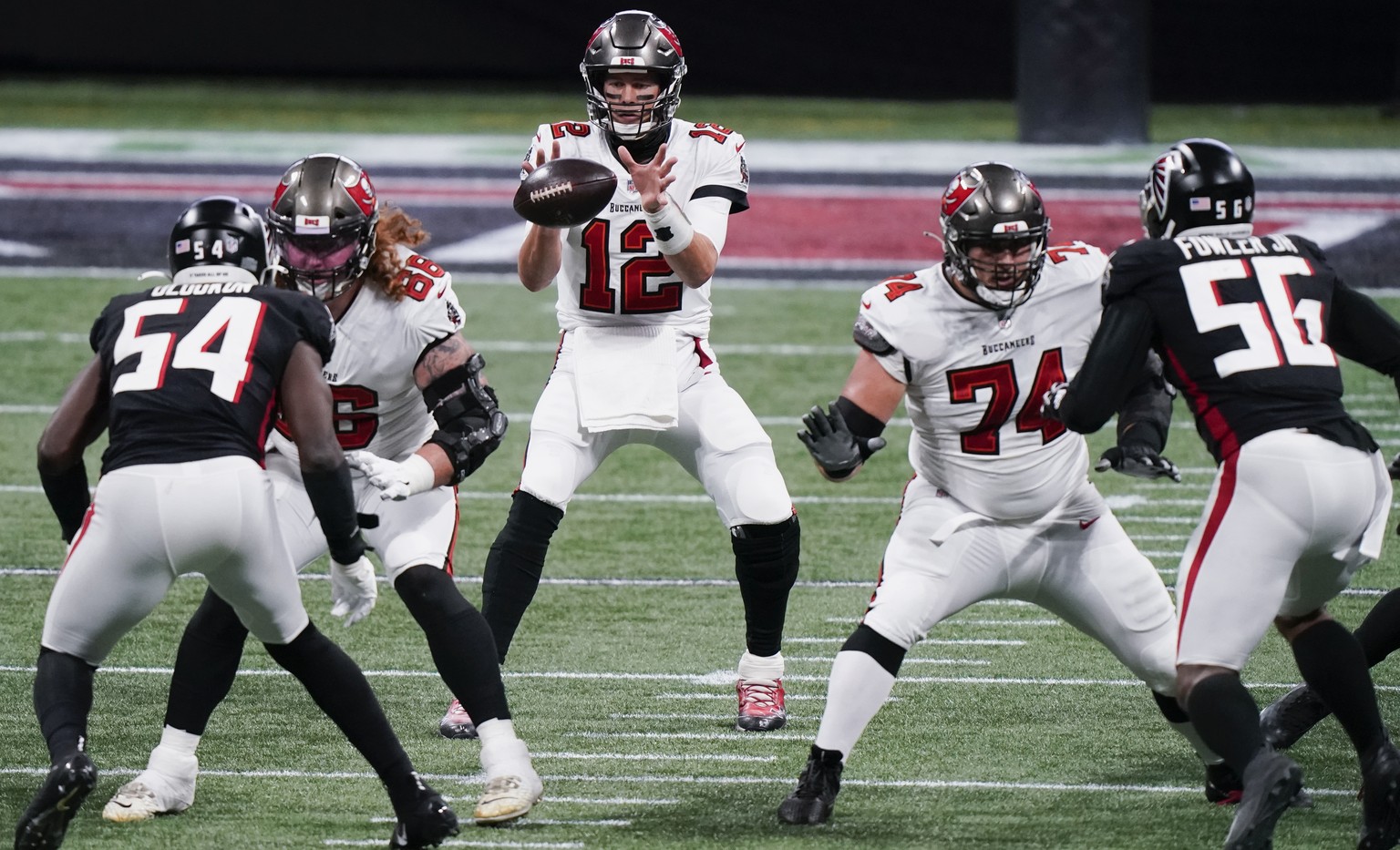 Tampa Bay Buccaneers quarterback Tom Brady (12) works in the pocket against the Atlanta Falcons during the first half of an NFL football game, Sunday, Dec. 20, 2020, in Atlanta. (AP Photo/Brynn Anders ...