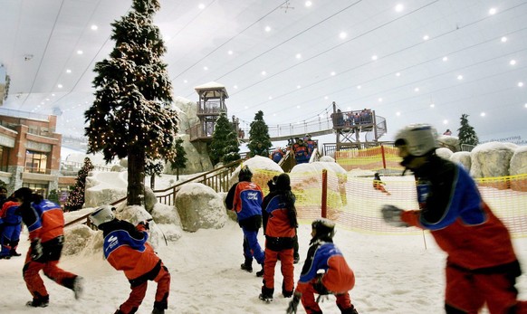 A friendly snowball fight erupts at Ski Dubai in Dubai, United Arab Emirates on Friday, 23 December 2005. Ski Dubai, opened earlier this month, is an indoor ski resort featuring man-made snow and whic ...