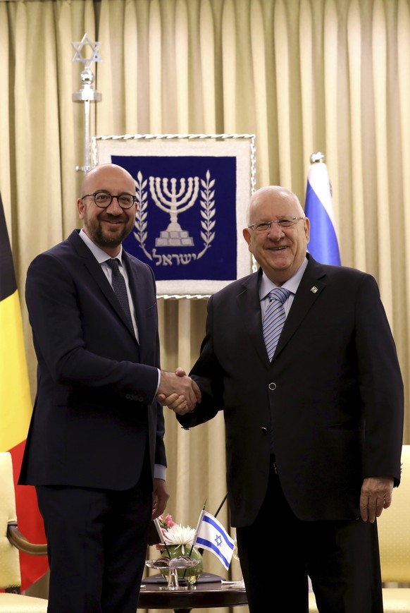 Belgian Prime Minister Charles Michel, left, shakes hands with Israeli President Reuven Rivlin at the presidential compound in Jerusalem on Monday, Feb. 6, 2017. (Gali Tibbon, Pool via AP)