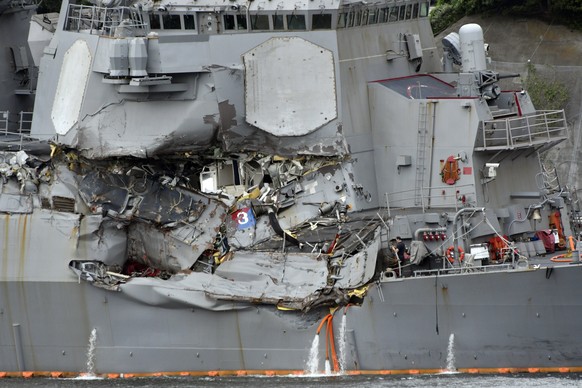 epa06034591 The damaged US Navy destroyer USS Fitzgerald is seen berthing at Yokosuka Naval Base in Yokosuka, south of Tokyo, Japan, 18 June 2017. Media reports state that seven US Navy sailors were f ...