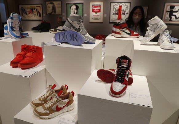 A selection of sneakers to be sold as part of the Pop Culture auction at Bonhams auction house in London, Thursday, Oct. 1, 2020. Including, a pair of Nike Sky Jordan 1, 1985 with Chicago Bulls White, ...