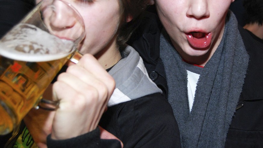 Young people, one with a beer mug are seen during a party in Vienna, on Saturday, Jan. 26, 2008 in Vienna. A June 2006 European Union-commissioned report says nearly all 15- to 16 year-old European st ...