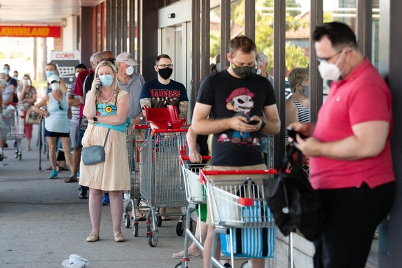 epa08978969 Shoppers queue in front of a shop in Maylands to open in Perth, Australia, 01 February 2021. West Australian Premier Mark McGowan yesterday called for a five-day lockdown for metropolitan  ...