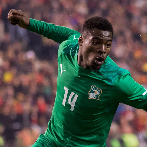 FILE - In this March 5, 2014, file photo, Ivory Coast&#039;s Serge Aurier runs with the ball during a friendly soccer match against Belgium at the King Baudouin stadium in Brussels. The Elephants had  ...
