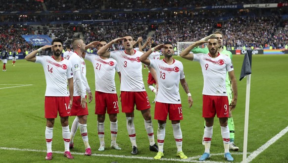 Turkey&#039;s players salute as they celebrate a goal against France during the Euro 2020 group H qualifying soccer match between France and Turkey at Stade de France at Saint Denis, north of Paris, F ...
