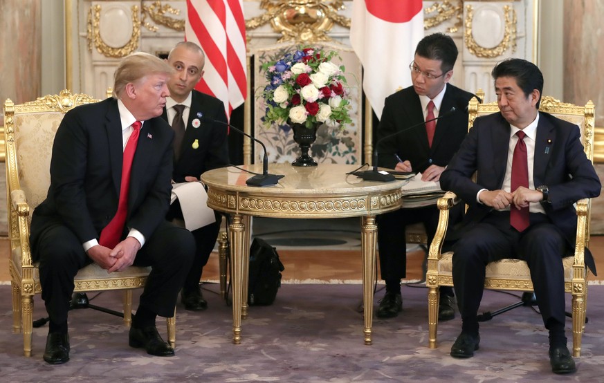 U.S. President Donald Trump, left, meets Japanese Prime Minister Shinzo Abe at Akasaka Palace, Japanese state guest house in Tokyo, Monday, May 27, 2019.(AP Photo/Eugene Hoshiko, Pool)