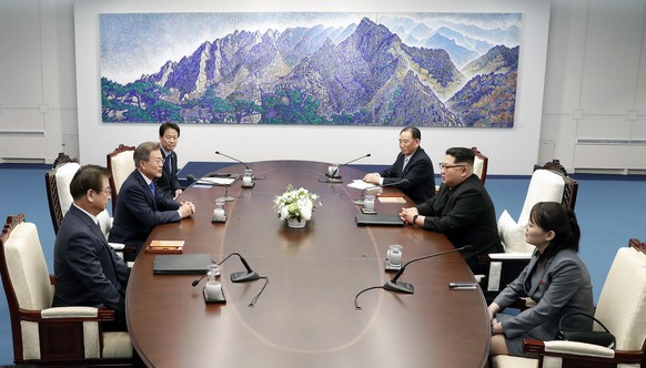 North Korean leader Kim Jong Un, second from right, and South Korean President Moon Jae-in, second from left, attend during a summit at Peace House of the border village of Panmunjom in the Demilitari ...