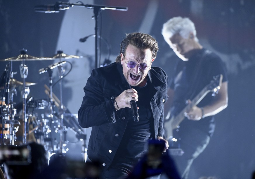 FILE - In this June 11, 2018 file photo, Bono of U2 performs during a concert at the Apollo Theater in New York. U2 raked in over $1 billion in sales to be named the artist of the decade by Pollstar.  ...