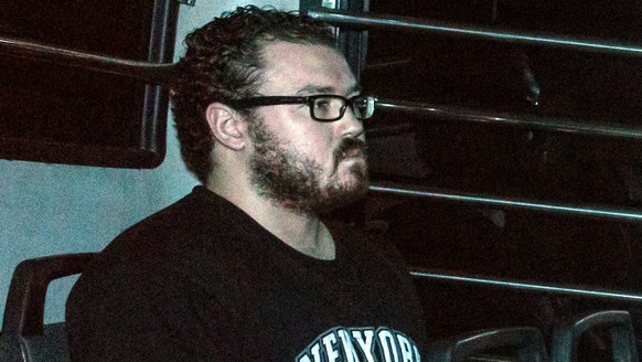 epa05621848 (FILE) A file picture dated 24 November 2014 shows former British banker Rurik George Caton Jutting leaving the Eastern Magistrates Court in a prison van, at Sai Wan Ho, Hong Kong, China.  ...