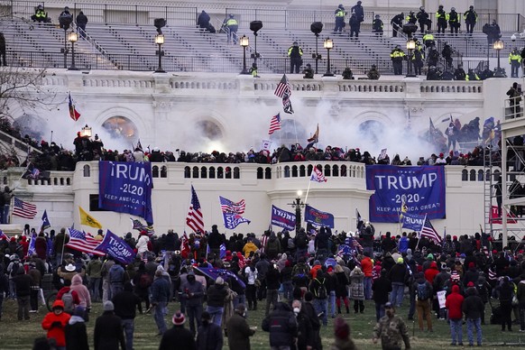 FILE - In this Wednesday, Jan. 6, 2021, file photo, violent protesters, loyal to President Donald Trump, storm the Capitol, in Washington. A pro-China network of fake and imposter accounts found a glo ...