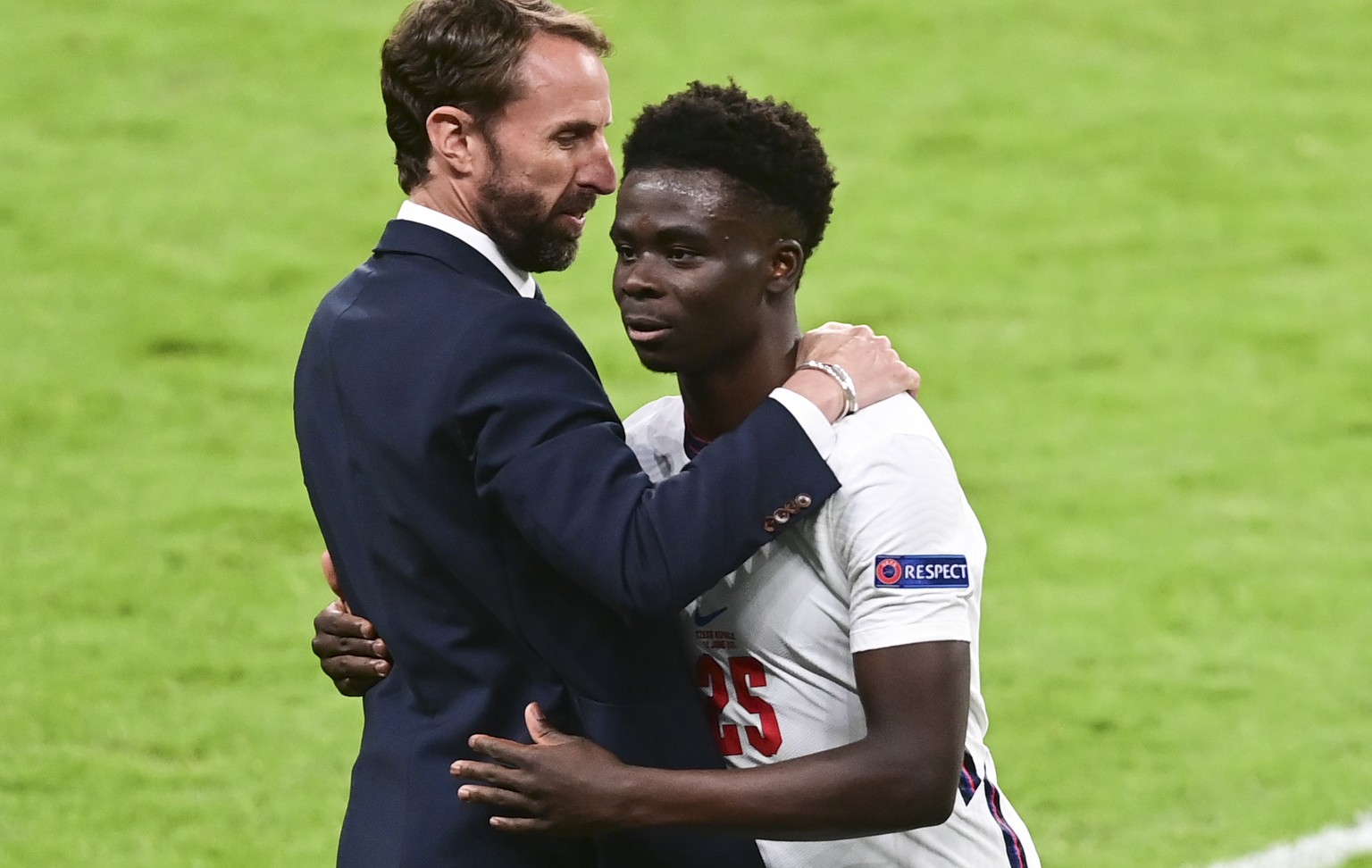 England&#039;s manager Gareth Southgate embraces Bukayo Saka as he leaves the field during the Euro 2020 soccer championship group D match between the Czech Republic and England at Wembley stadium, Lo ...