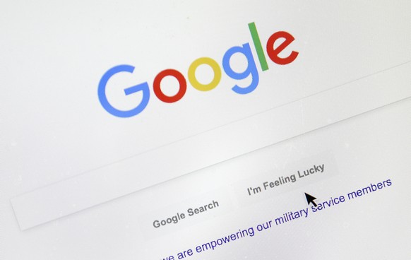 FILE - In this Aug. 28, 2018, file photo, a cursor moves over Google&#039;s search engine page, in Portland, Ore. Google is paying more attention to the small words in your searches. Google is rolling ...