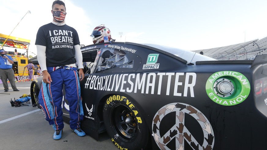 Driver Bubba Wallace waits for the start of a NASCAR Cup Series auto race Wednesday, June 10, 2020, in Martinsville, Va. (AP Photo/Steve Helber)
Bubba Wallace