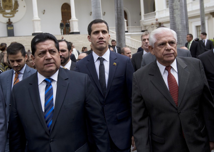 FILE - In this Jan. 5, 2019 file photo, incoming National Assembly Vice President Edgar Zambrano, left, arrives with incoming National Assembly President Juan Guaido, center, and Omar Barboza, outgoin ...
