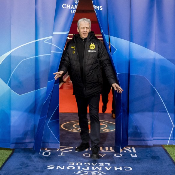 epa08287421 A handout photo made available by the UEFA shows head coach Lucien Favre of Borussia Dortmund arriving to the stadium ahead the UEFA Champions League round of 16 second leg match between P ...