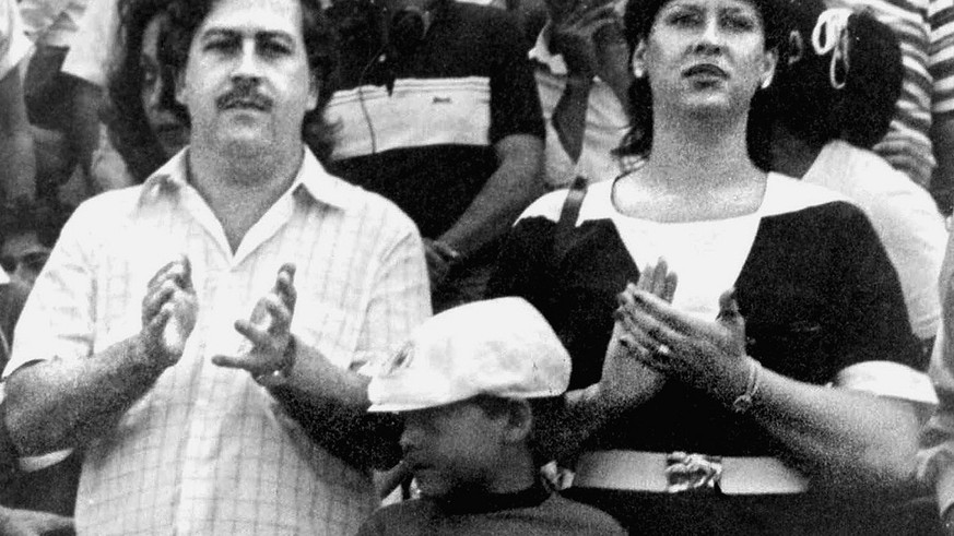 FILE--Pablo Escobar, left, boss of the Medellin drug cartel, is shown with his wife, Victoria Henau Vallejos, right, and son while attending a soccer match in Bogota, Colombia in this undated file pho ...