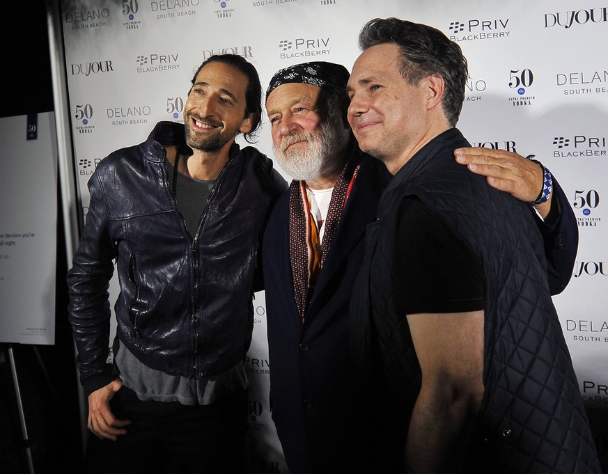 Actor Adrien Brody, from left, photographer Bruce Weber and Jason Binn pose for a photo during the annual Art Basel kick off party presented by Jason Binn publisher of DuJour Magazine at the Delano Ho ...