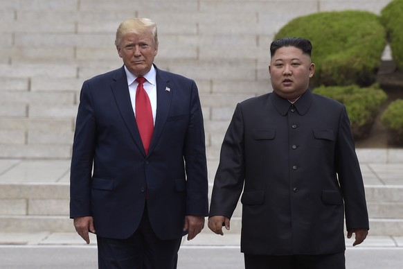 FILE- In this June 30, 2019, file photo, U.S. President Donald Trump, left, meets with North Korean leader Kim Jong Un at the North Korean side of the border at the village of Panmunjom in Demilitariz ...