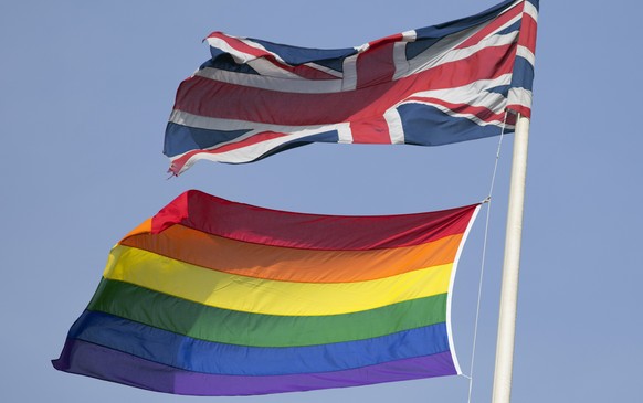 A rainbow flag flies with the Union flag above British Cabinet Offices, marking the first day Britain has allowed same sex marriages, in London March 29, 2014. Prime Minister David Cameron hailed Brit ...