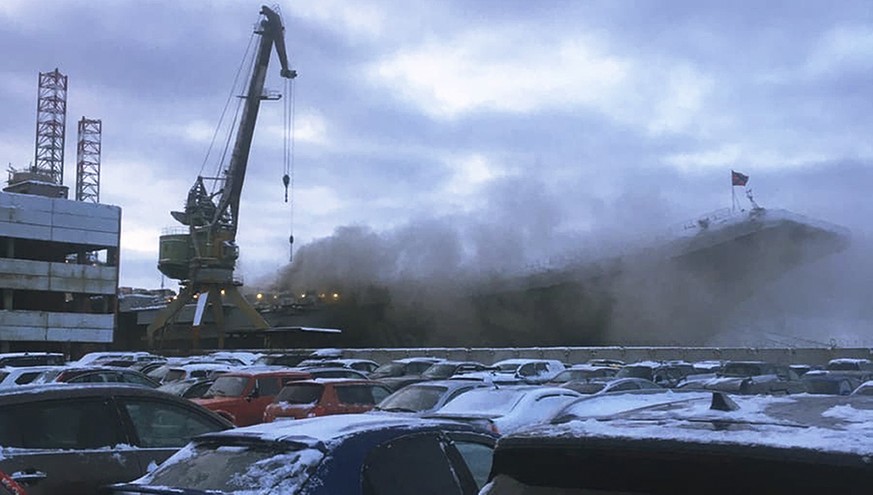 In this handout photo provided by an anonymous source, smoke billows from the Admiral Kuznetsov carrier during a fire in Murmansk, Russia, Thursday, Dec. 12, 2019. A fire on Russia&#039;s only aircraf ...