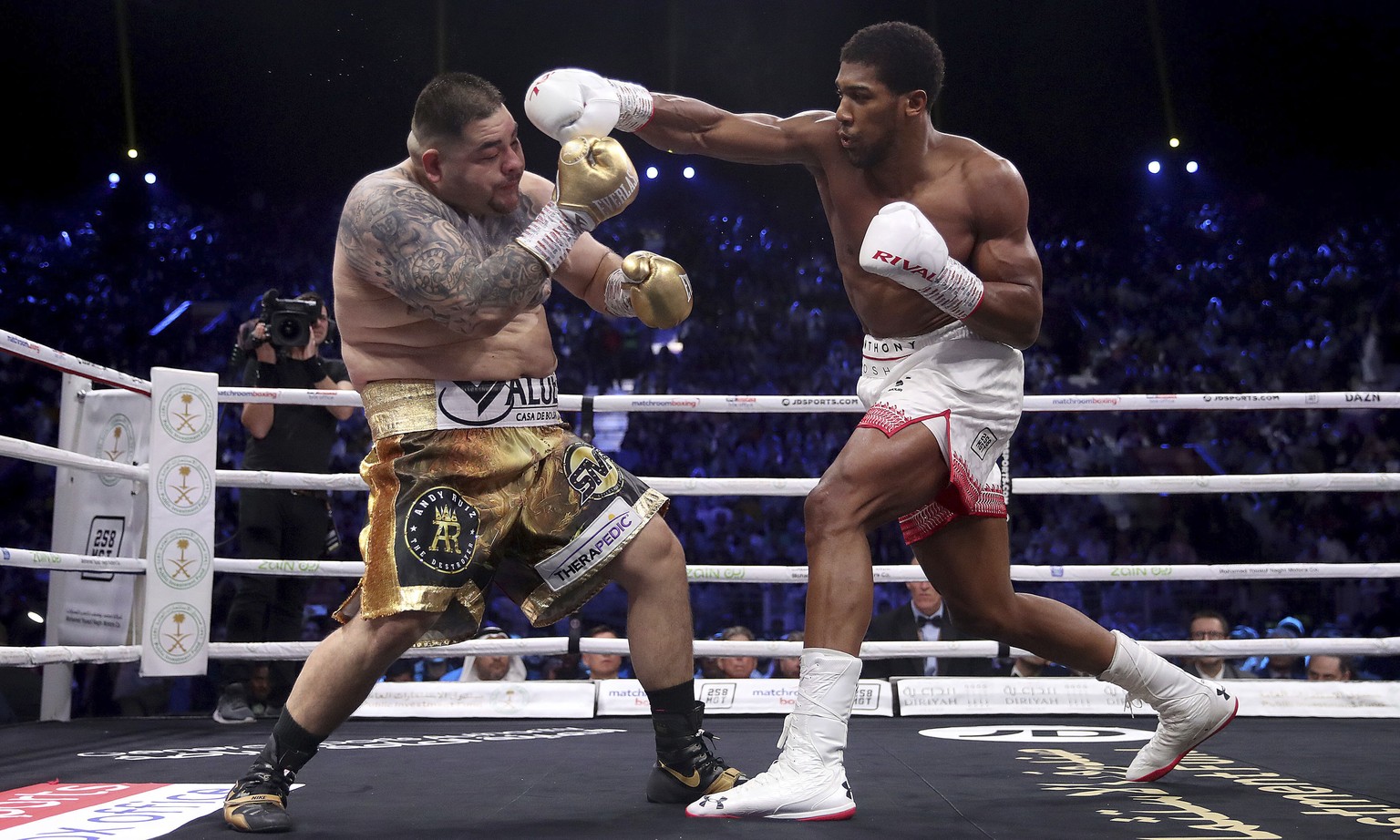 Defending champion Andy Ruiz Jr., left, during his fight against Britain&#039;s Anthony Joshua in their World Heavyweight Championship contest at the Diriyah Arena, Riyadh, Saudi Arabia. (Nick Potts/P ...