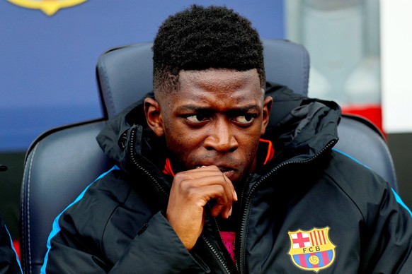 epa06515517 Barcelona&#039;s Ousmane Dembele sits on the bench before the Spanish Primera Division soccer match between FC Barcelona and Getafe CF at Camp Nou in Barcelona, Spain, 11 February 2018. EP ...