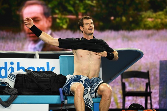 epa05727218 Andy Murray of Britain changes his shirt during a break of his men&#039;s Singles second round match against Andrey Rublev of Russia at the Australian Open Grand Slam tennis tournament in  ...