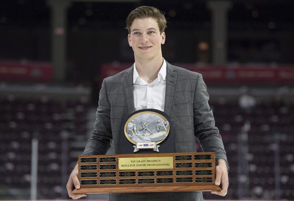 This photo taken May 27, 2107, shows Top Prospect Award recipient Nolan Patrick, from the Brandon Wheat Kings, holding his trophy following a media availability at the Memorial Cup in Windsor, Ontario ...